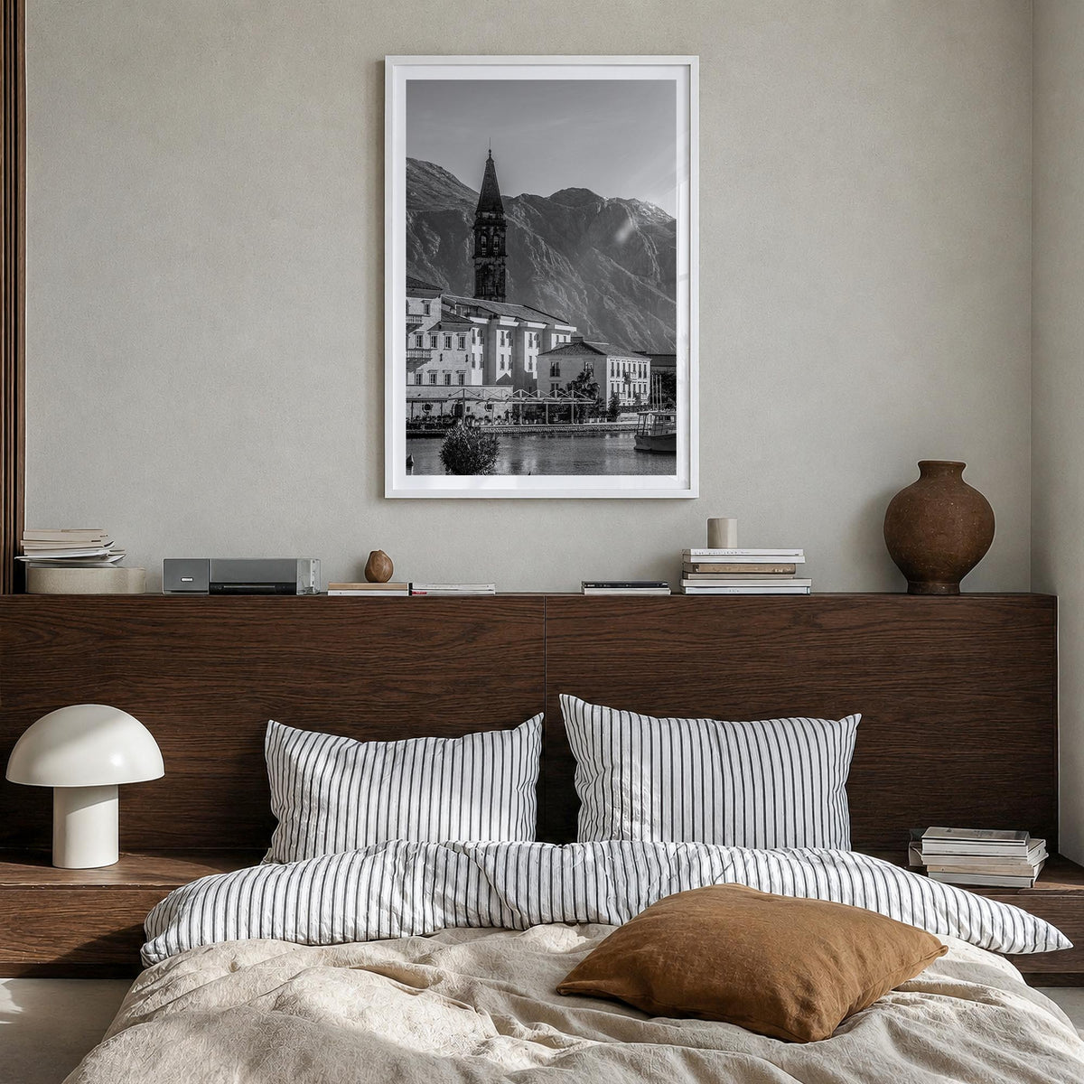 Kotor black & white photo poster of Montenegro – vertical wall art in white wood frame with white border, hanging on wall