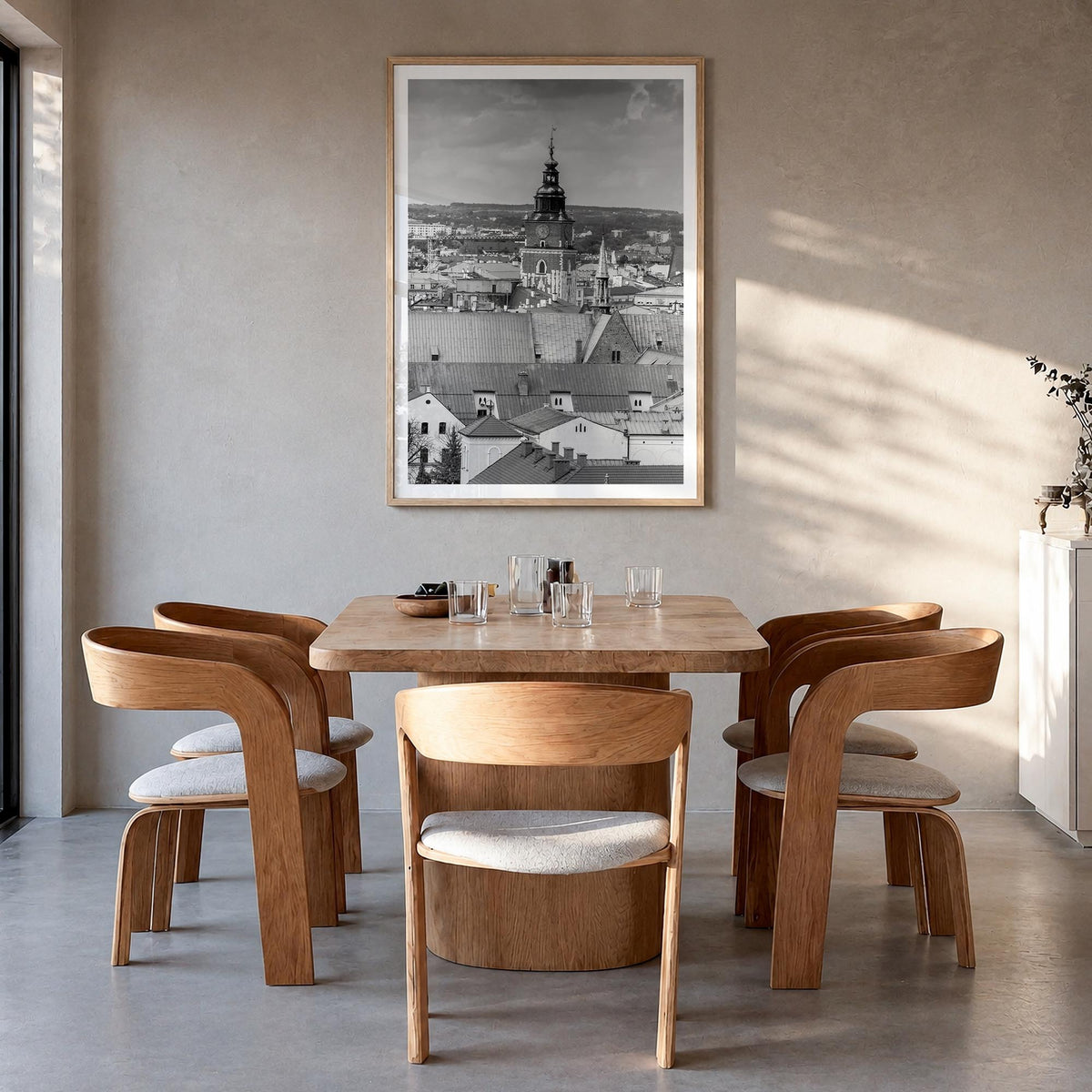 Kraków black & white photo poster of Poland – vertical wall art in natural wood frame with white border, hanging on wall