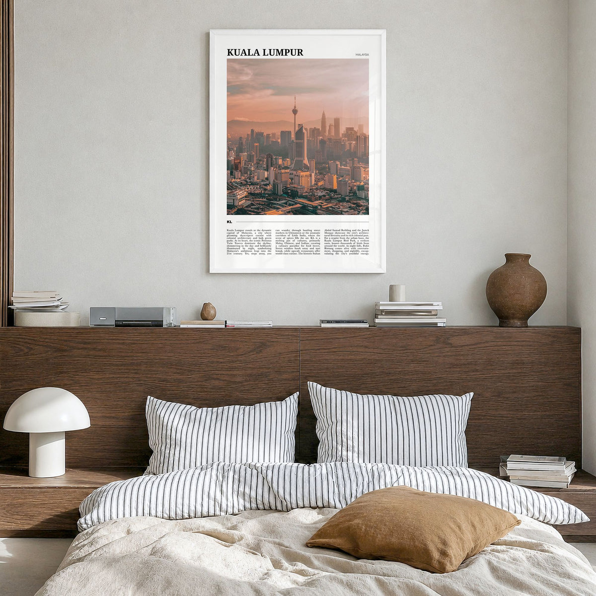 Kuala Lumpur Travel Poster in a white wood frame, hanging in a bedroom