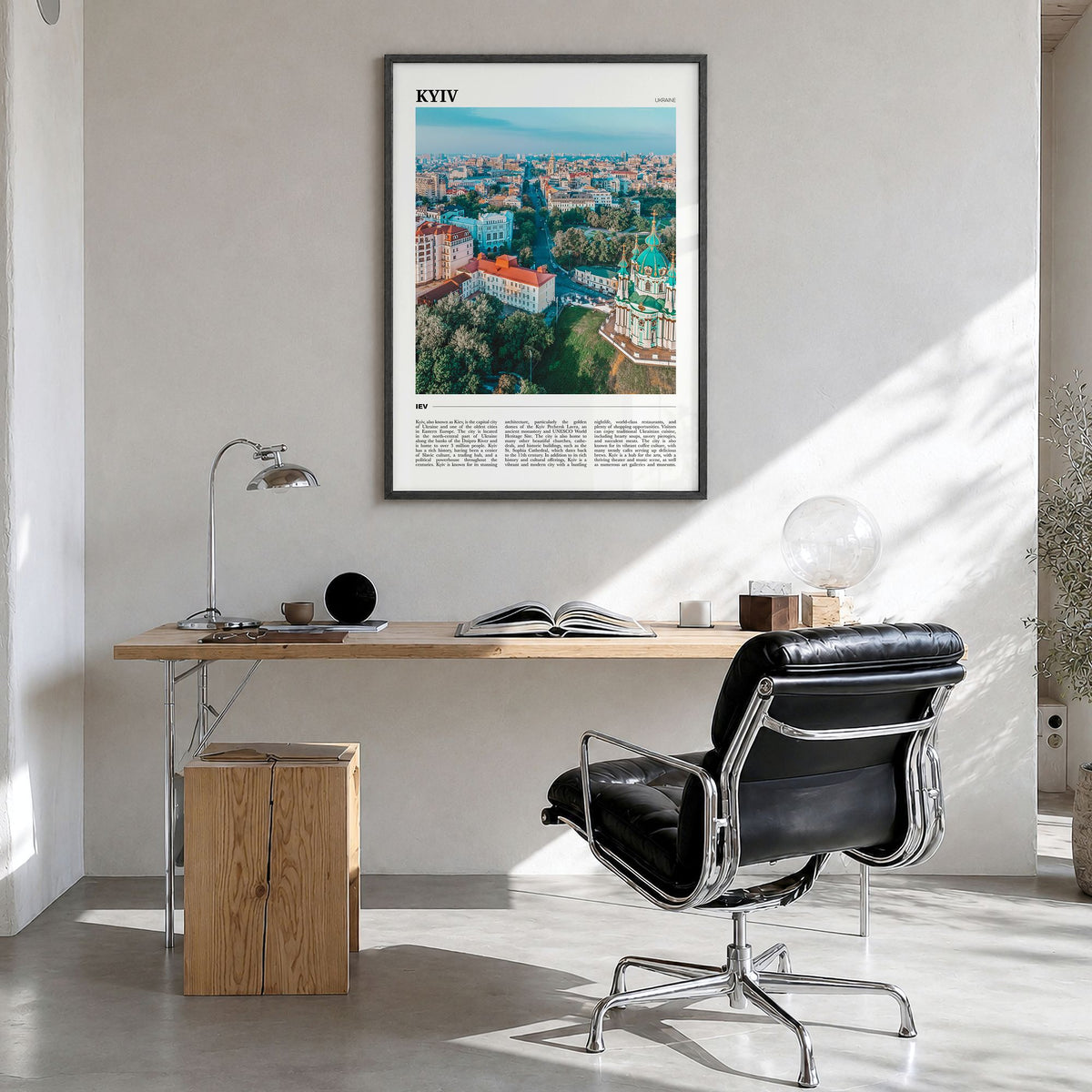 Kyiv Travel Poster in a black wood frame, hanging in a bright home office