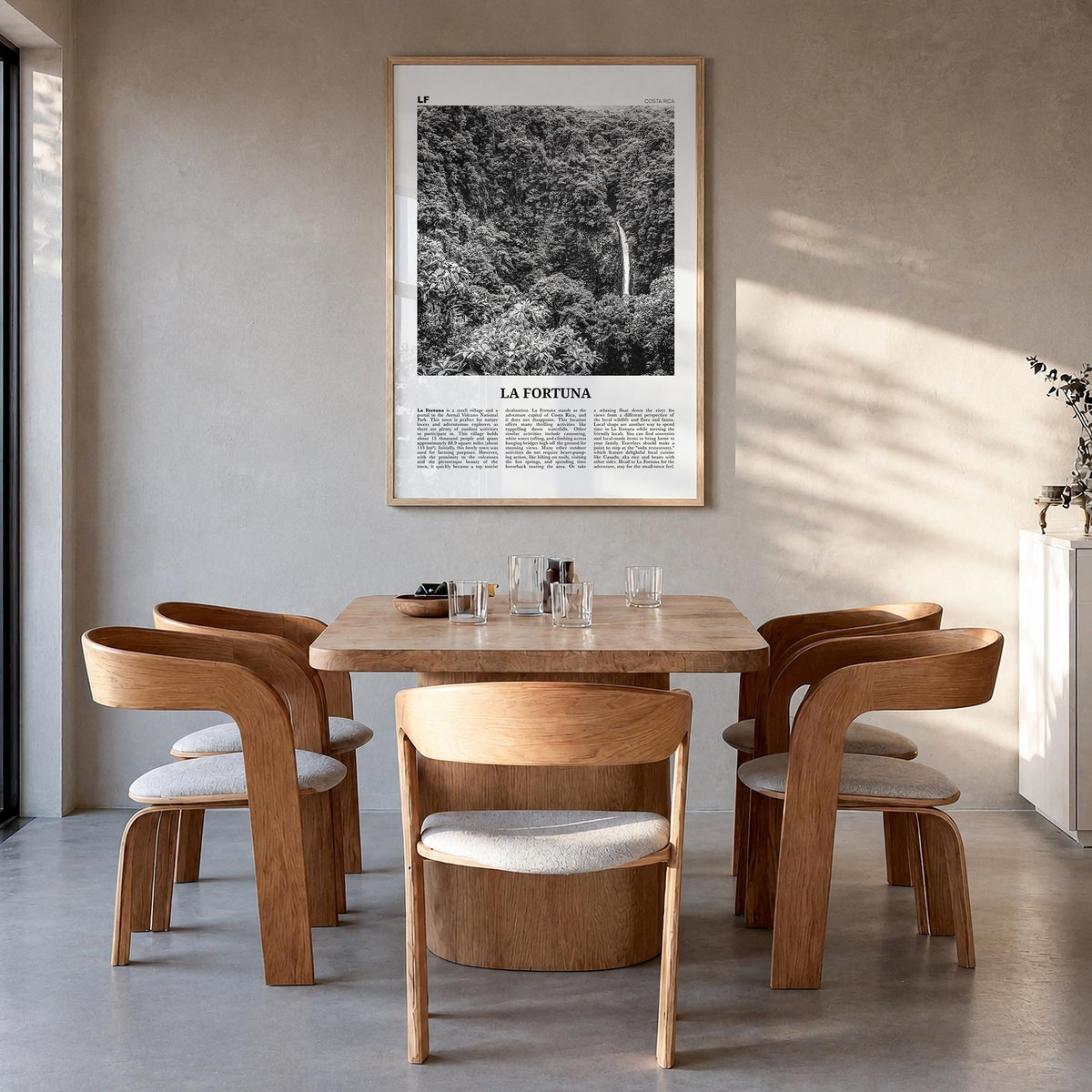 La Fortuna black & white newspaper poster of Costa Rica – vertical wall art in natural wood frame, hanging on wall