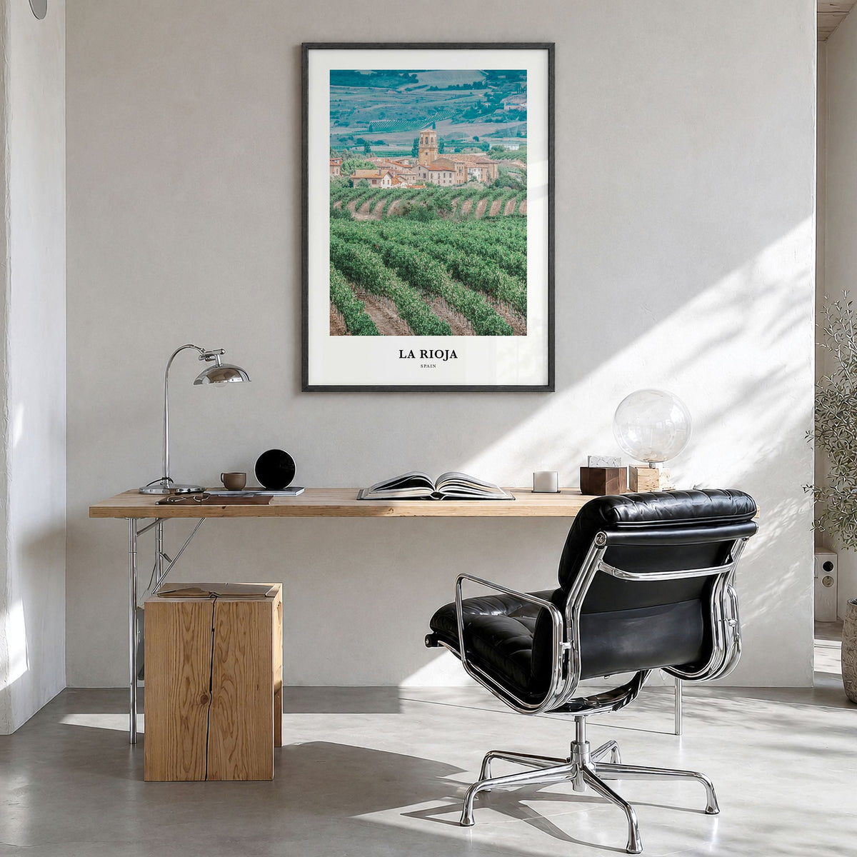 La Rioja Classic Poster in a black wood frame, hanging in a bright home office