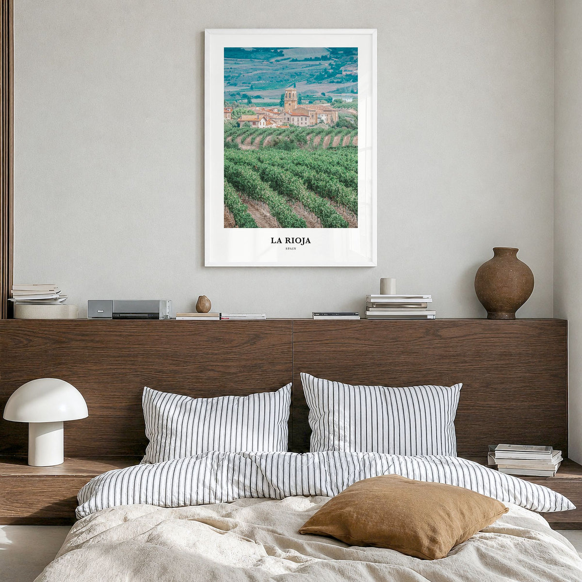 La Rioja Classic Poster in a white wood frame, hanging in a bedroom