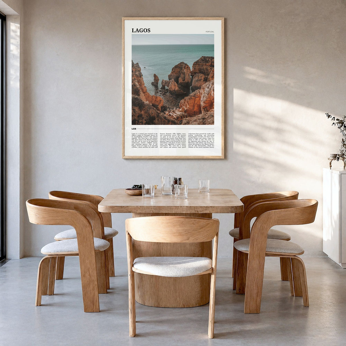 Lagos, Portugal Travel Poster in a natural wood frame, hanging in a dining room