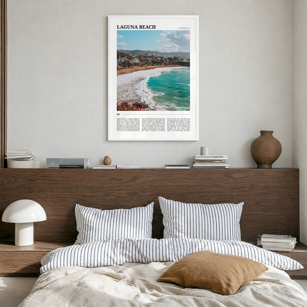 Laguna Beach Travel No 2 Poster in a white wood frame, hanging in a bedroom
