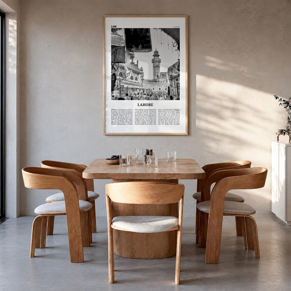 Lahore no. 1 black & white newspaper poster of Pakistan – vertical wall art in natural wood frame, hanging on wall