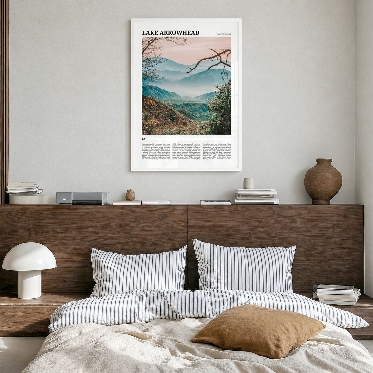 Lake Arrowhead Travel Poster in a white wood frame, hanging in a bedroom