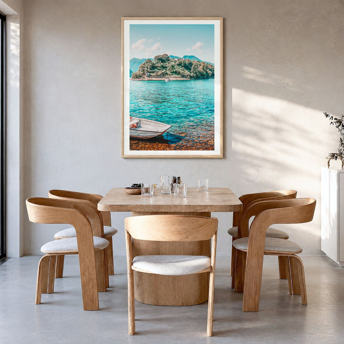 Lake Como Photo No 3 Poster in a natural wood frame, hanging in a dining room, white border