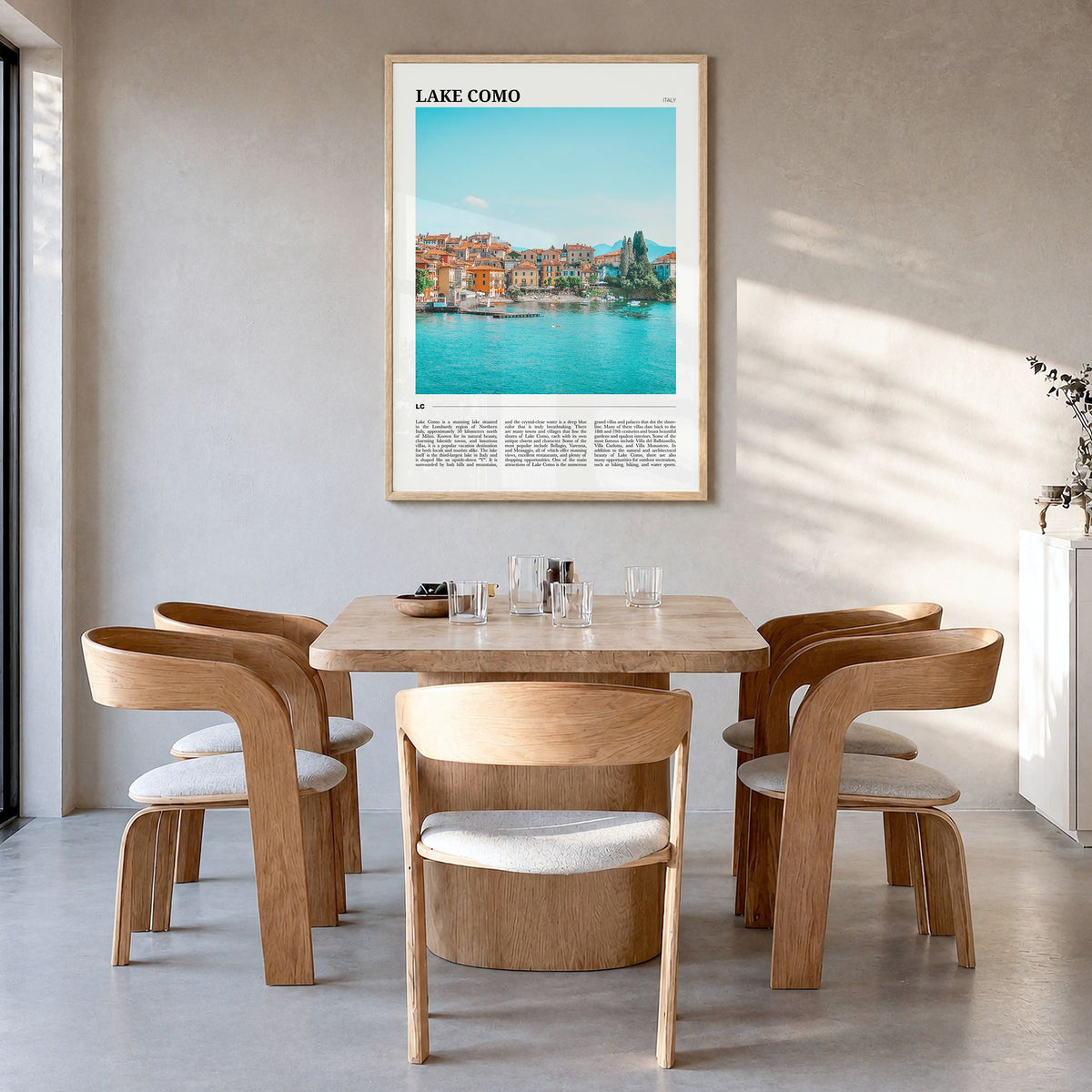 Lake Como Travel No 1 Poster in a natural wood frame, hanging in a dining room