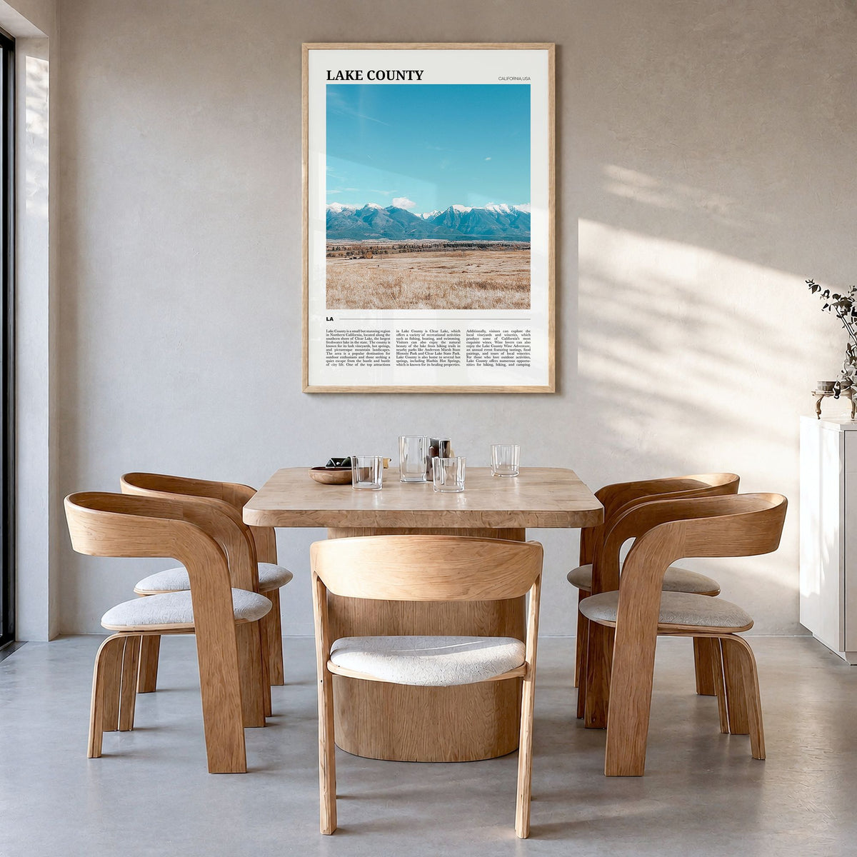 Lake County Travel Poster in a natural wood frame, hanging in a dining room