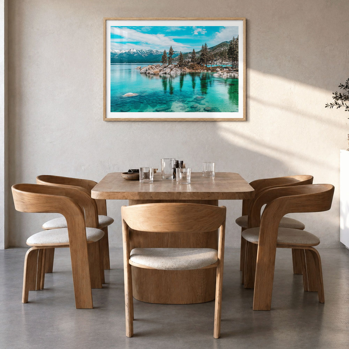 Lake Tahoe Photo Poster in a natural wood frame, hanging in a dining room, white border