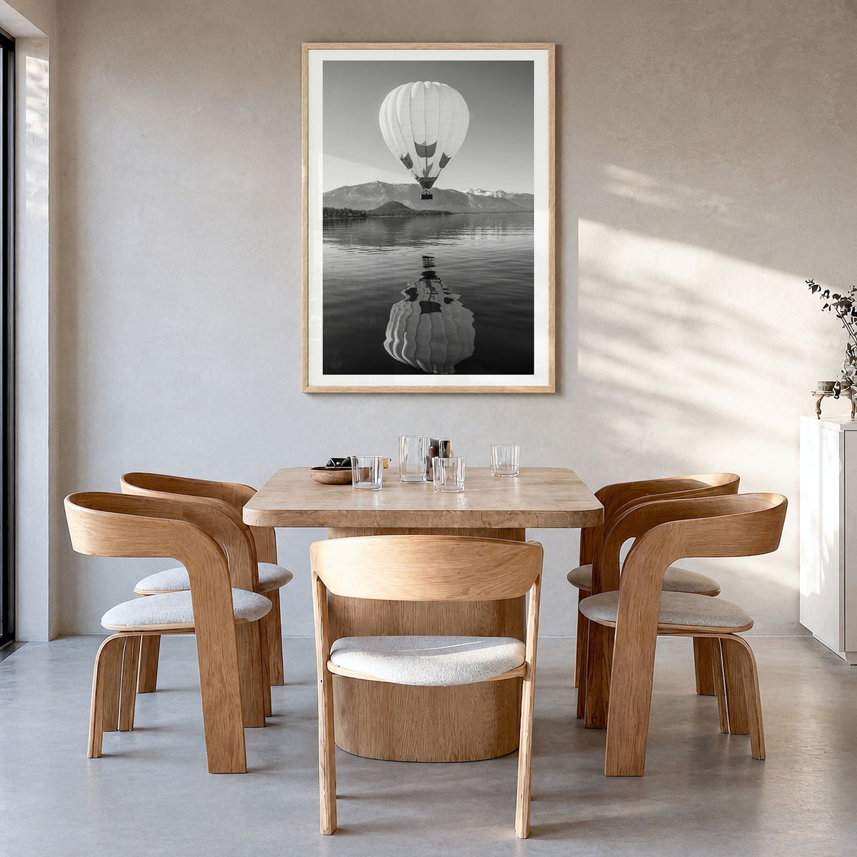 Lake Tahoe Photo No 3 Poster in a natural wood frame, hanging in a dining room, white border