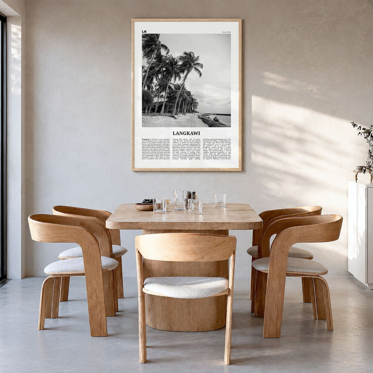Langkawi Newspaper Poster in a natural wood frame, hanging in a dining room