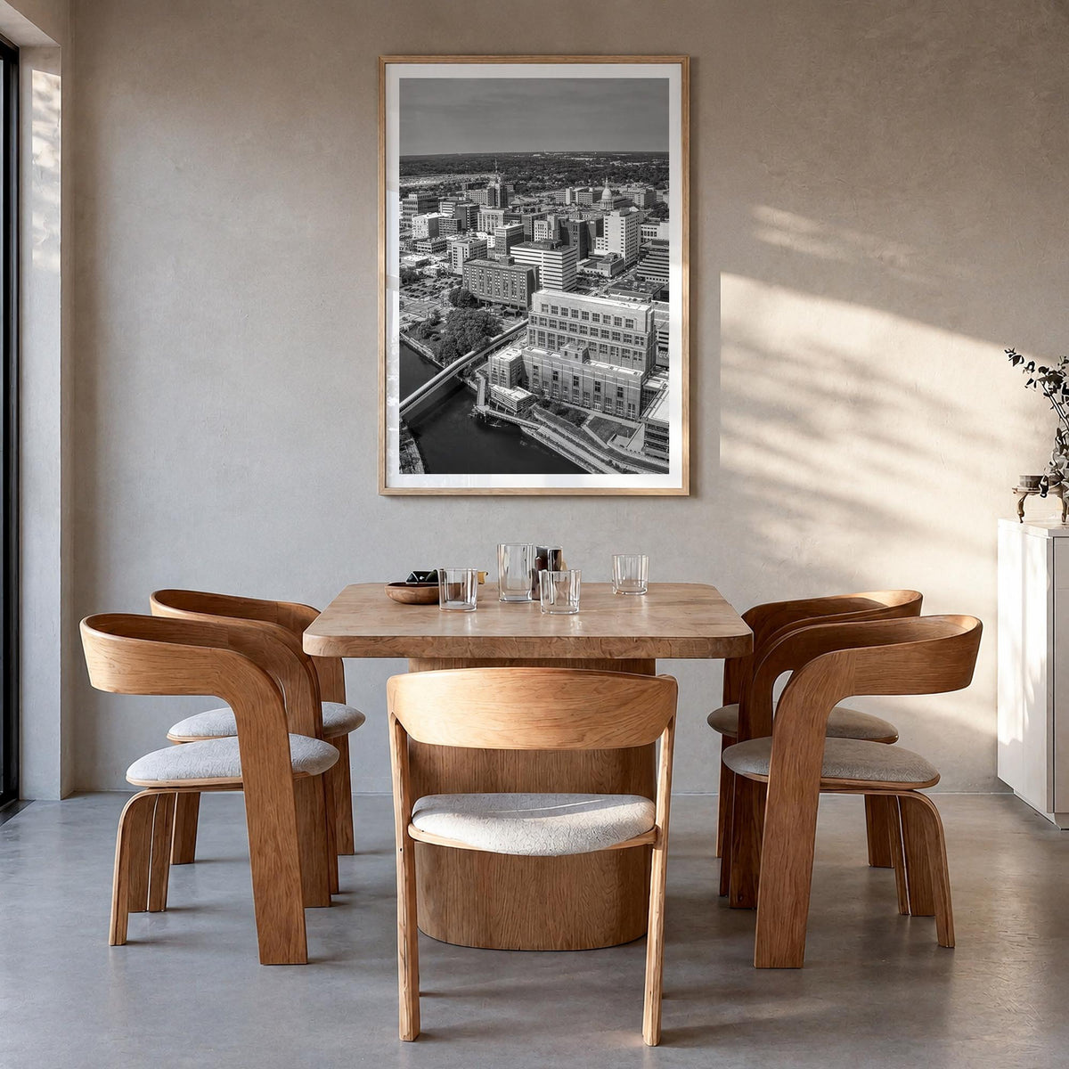 Lansing black & white photo poster of Michigan, USA – vertical wall art in natural wood frame with white border, hanging on w