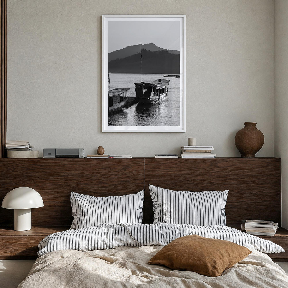 Laos black & white photo poster of Asia – vertical wall art in white wood frame with white border, hanging on wall
