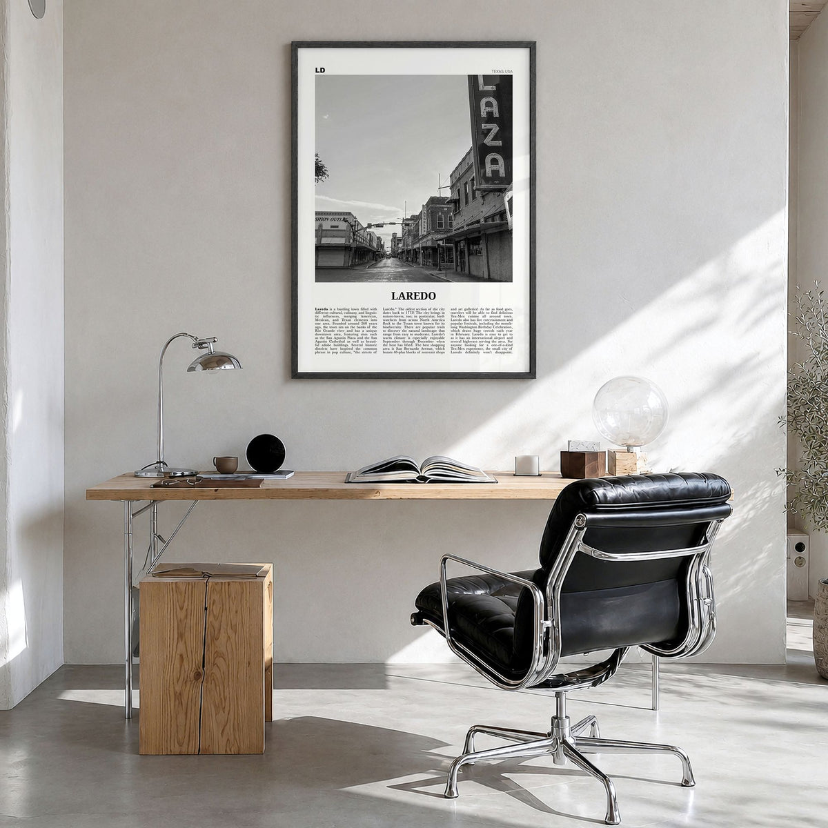 Laredo, Texas Newspaper Poster in a black wood frame, hanging in a bright home office