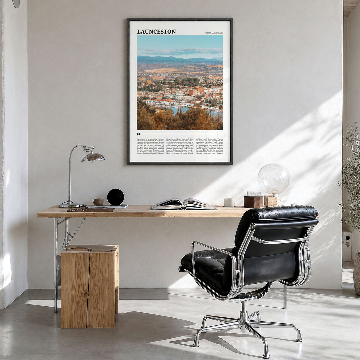 Launceston Travel Poster in a black wood frame, hanging in a bright home office