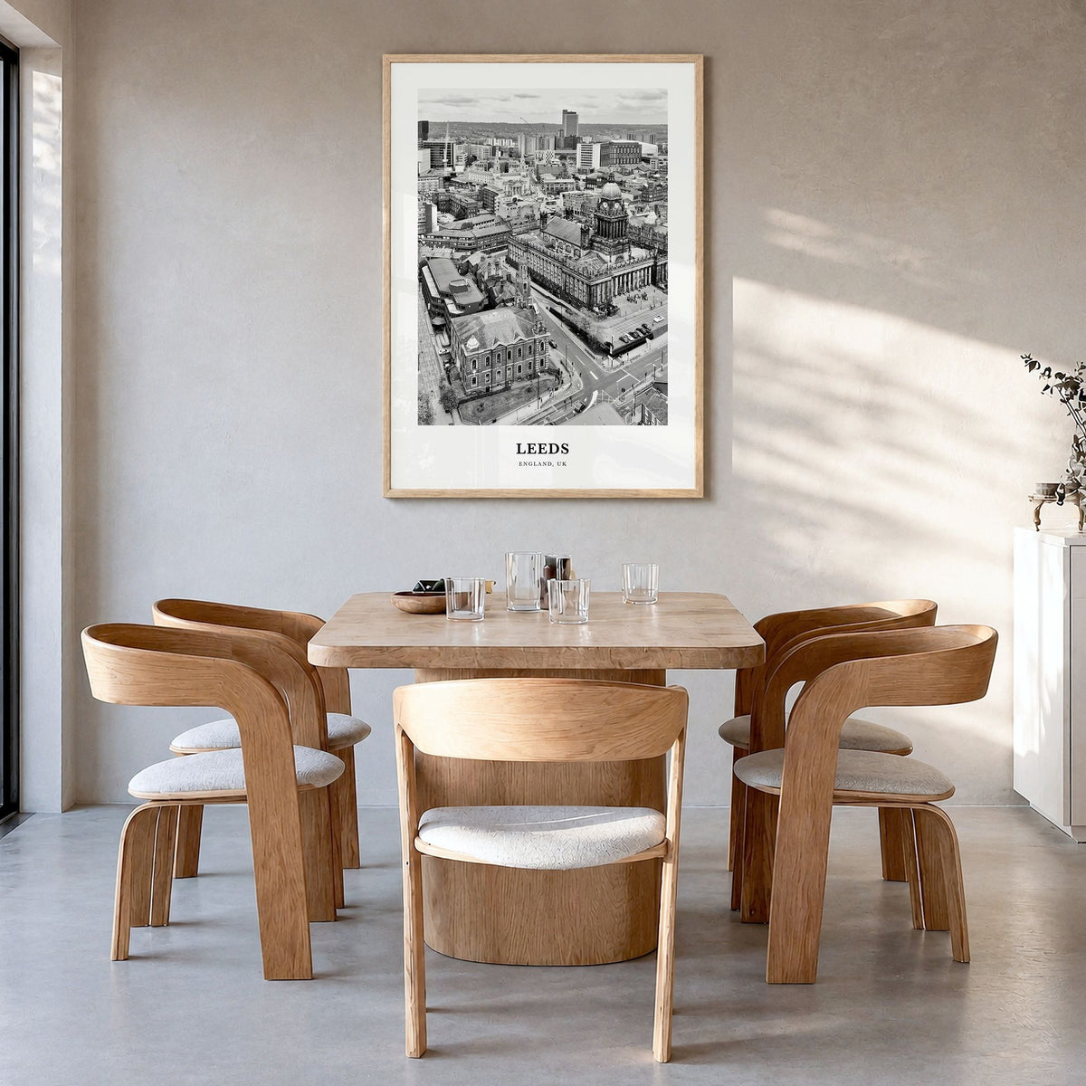 Leeds Classic Poster in a natural wood frame, hanging in a dining room