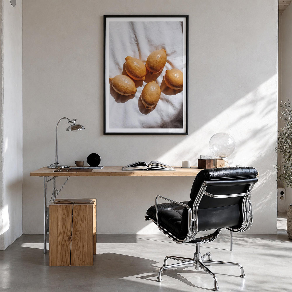 Lemons no. 2 colorful photo poster – vertical wall art in black wood frame with white border, hanging on wall