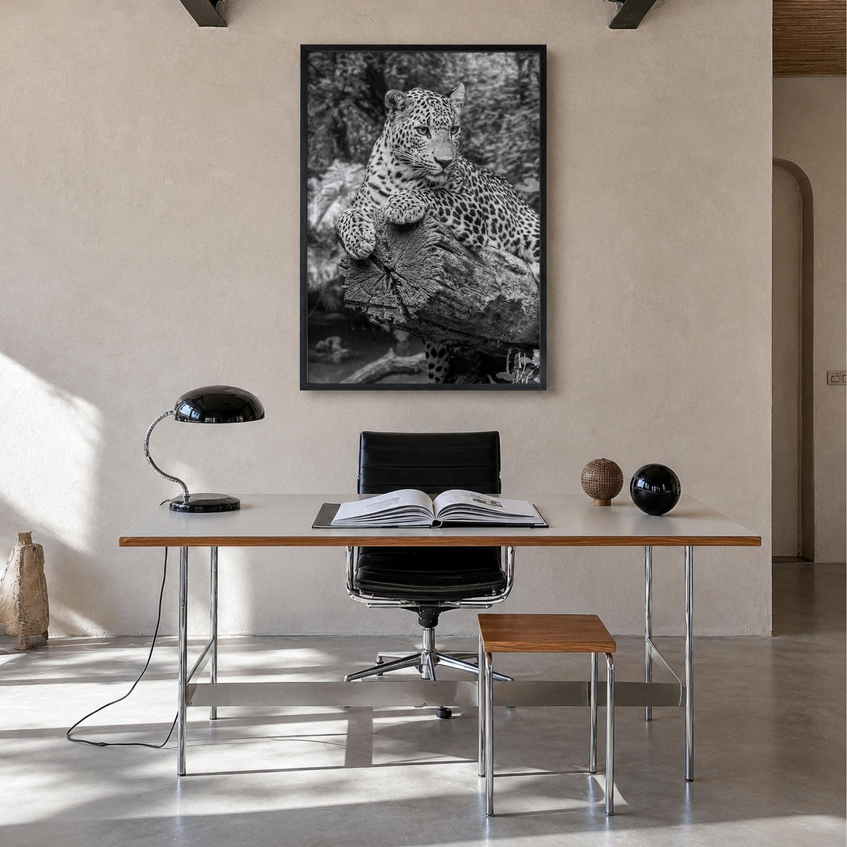 Leopard no. 2 black & white photo poster – vertical wall art in black wood frame, hanging on wall