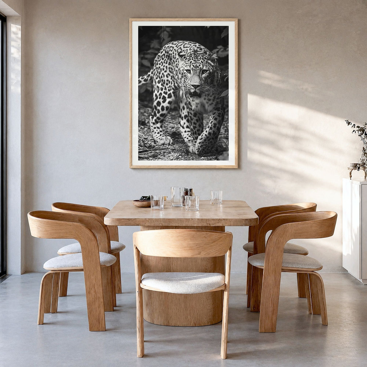 Leopard Photo No 1 Poster in a natural wood frame, hanging in a dining room, white border