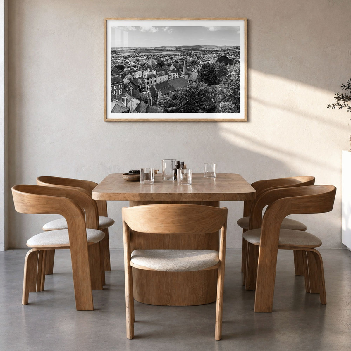 Lewes Photo Poster in a natural wood frame, hanging in a dining room, white border