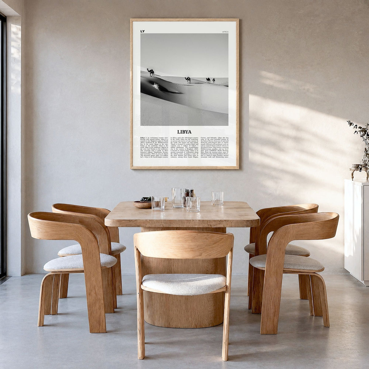 Libya Newspaper Poster in a natural wood frame, hanging in a dining room