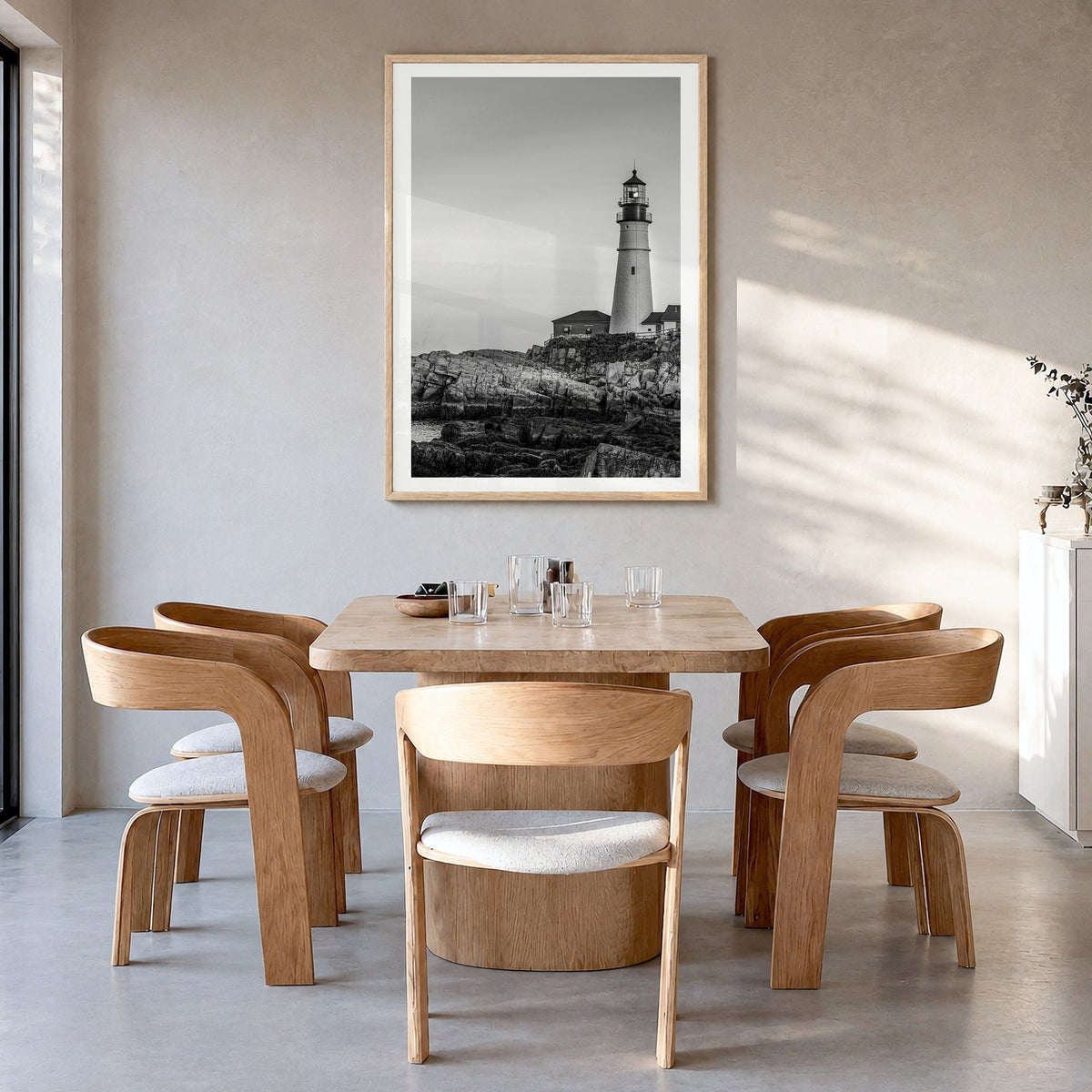 Lighthouse Photo No 1 Poster in a natural wood frame, hanging in a dining room, white border