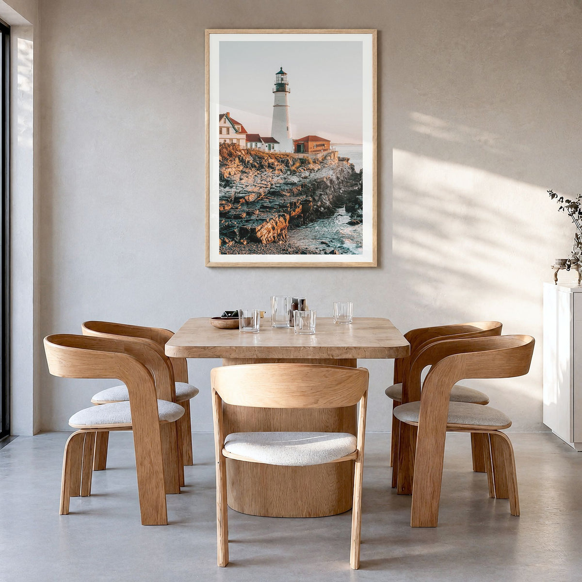 Lighthouse Photo No 2 Poster in a natural wood frame, hanging in a dining room, white border