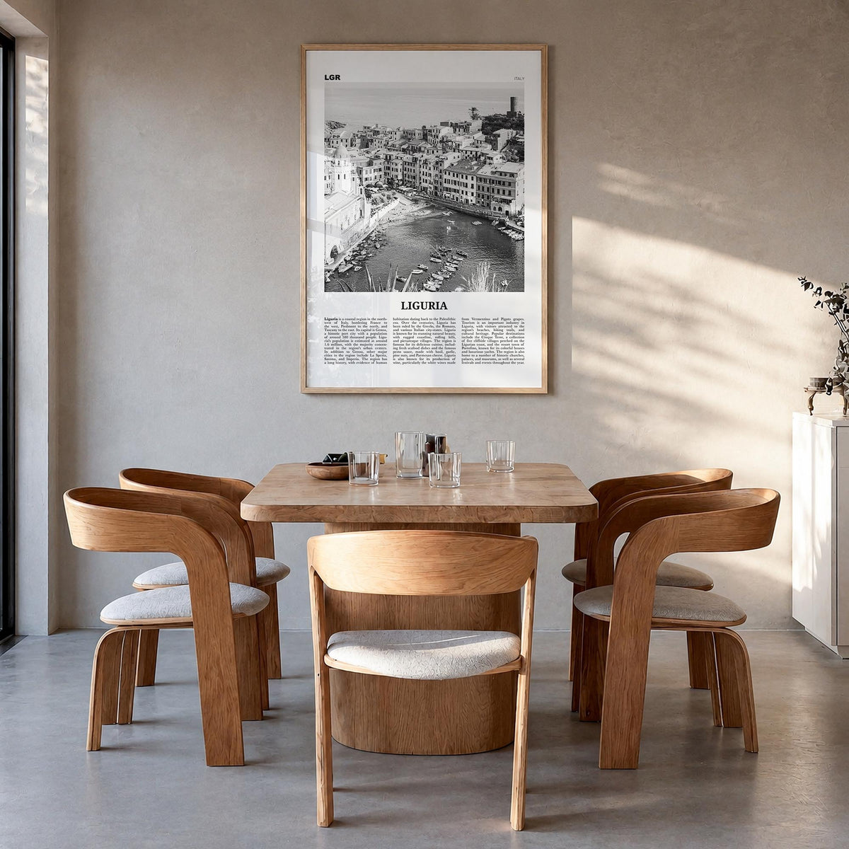 Liguria black & white newspaper poster of Italy – vertical wall art in natural wood frame, hanging on wall