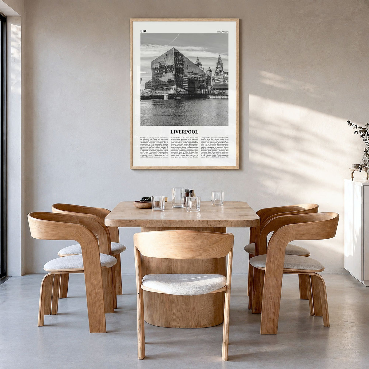 Liverpool Newspaper Poster in a natural wood frame, hanging in a dining room