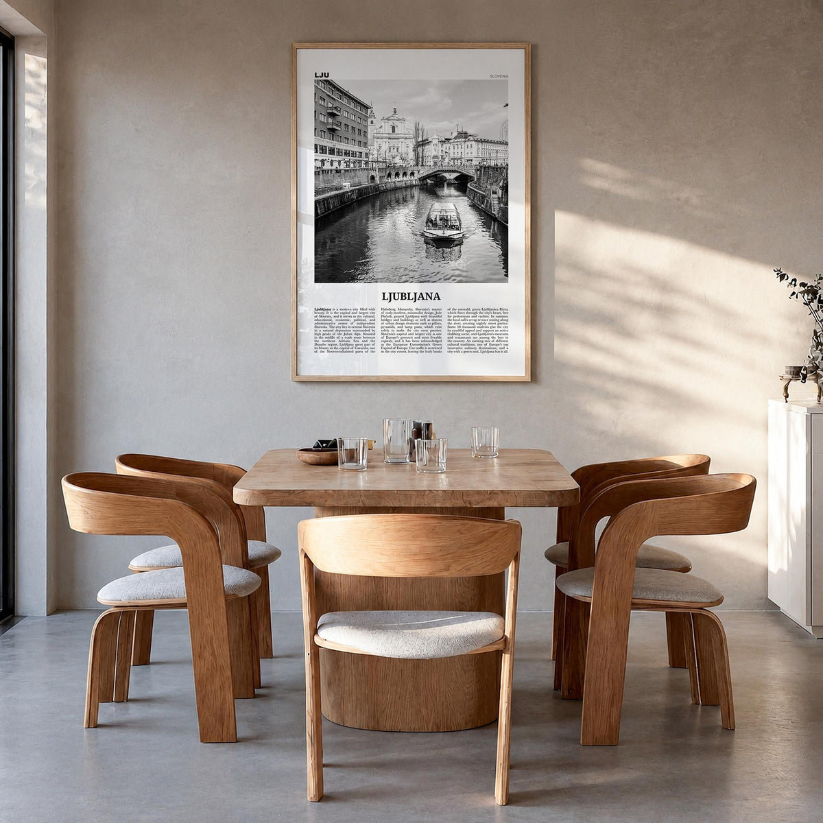 Ljubljana black & white newspaper poster of Slovenia – vertical wall art in natural wood frame, hanging on wall