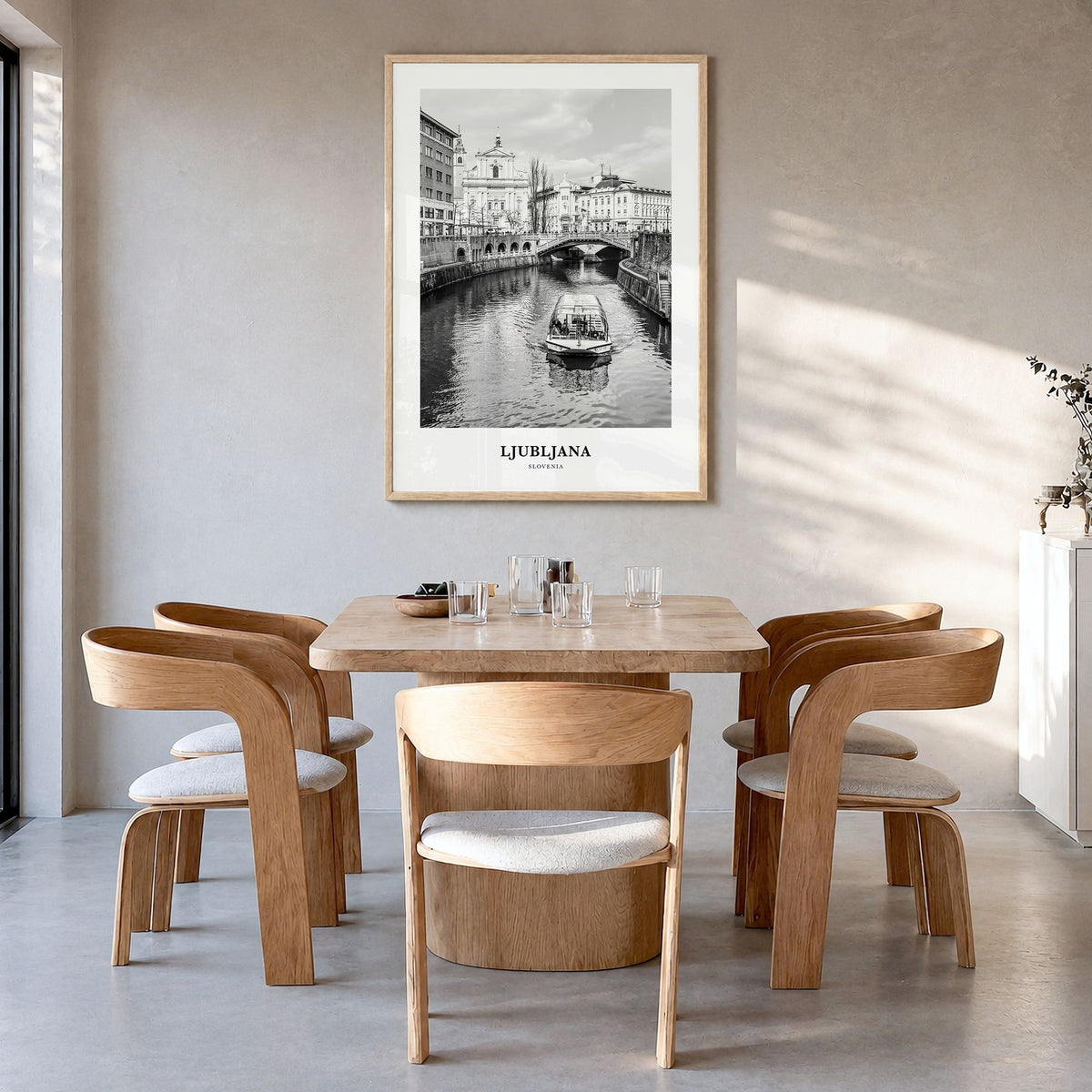 Ljubljana Classic Poster in a natural wood frame, hanging in a dining room