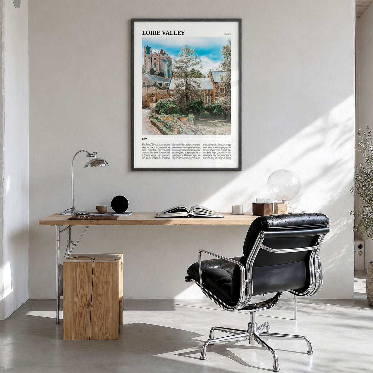 Loire Valley Travel Poster in a black wood frame, hanging in a bright home office