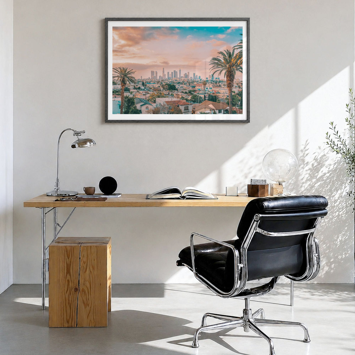Los Angeles Photo Poster in a black wood frame, hanging in a bright home office, white border