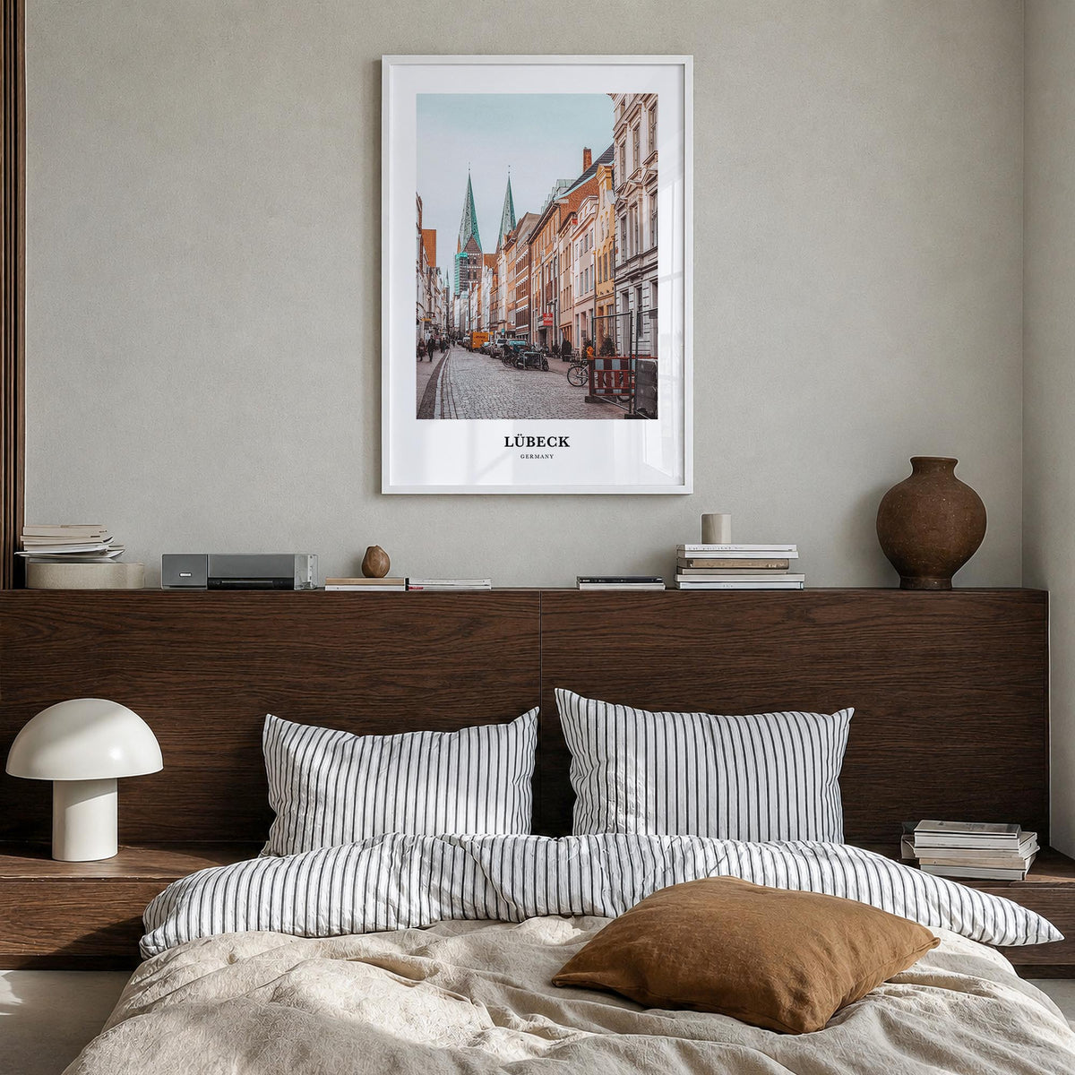Lübeck colorful classic poster of Germany – vertical wall art in white wood frame, hanging on wall