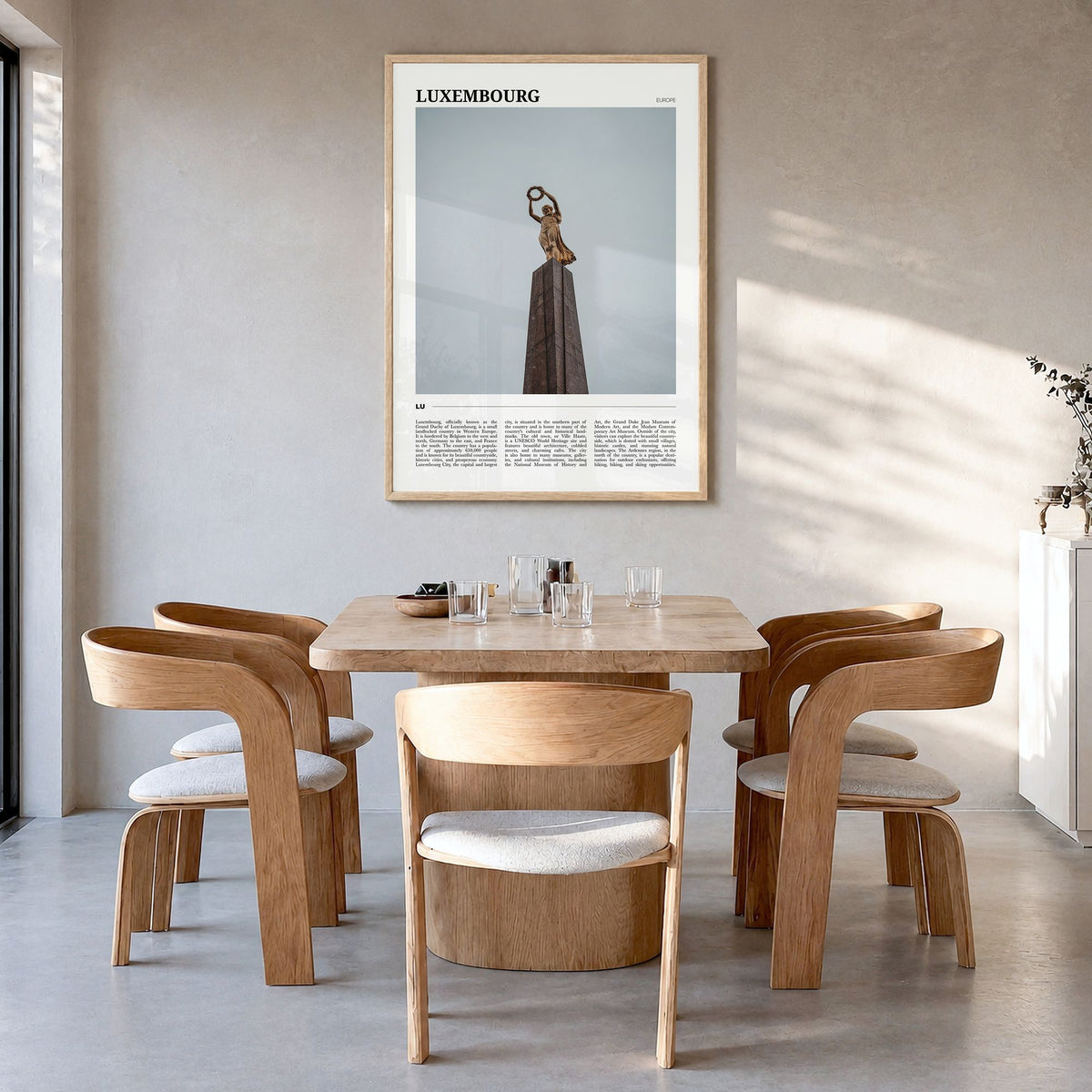 Luxembourg Travel Poster in a natural wood frame, hanging in a dining room