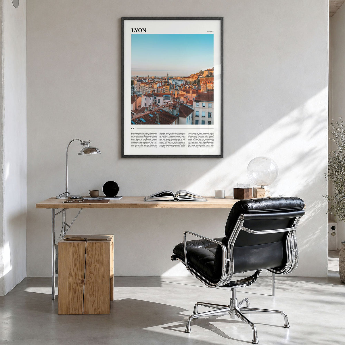 Lyon Travel Poster in a black wood frame, hanging in a bright home office