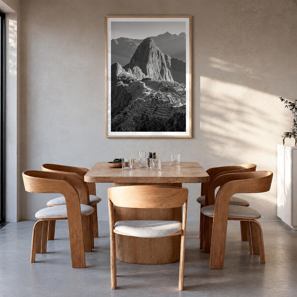 Machu Picchu black & white photo poster of Peru – vertical wall art in natural wood frame with white border, hanging on wall