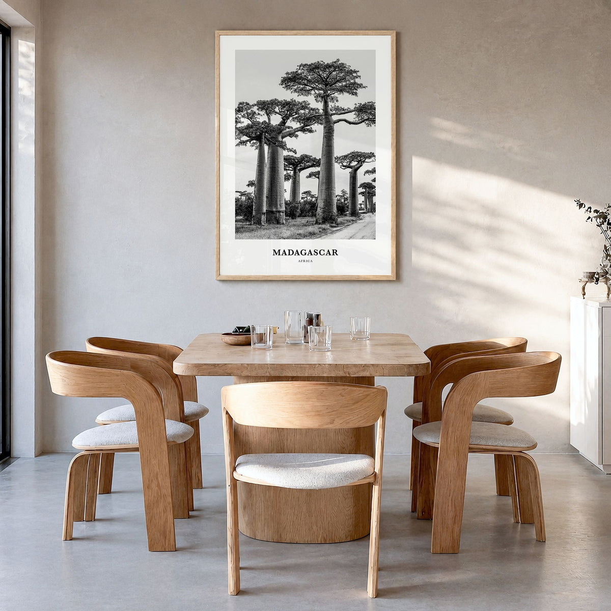 Madagascar Classic Poster in a natural wood frame, hanging in a dining room