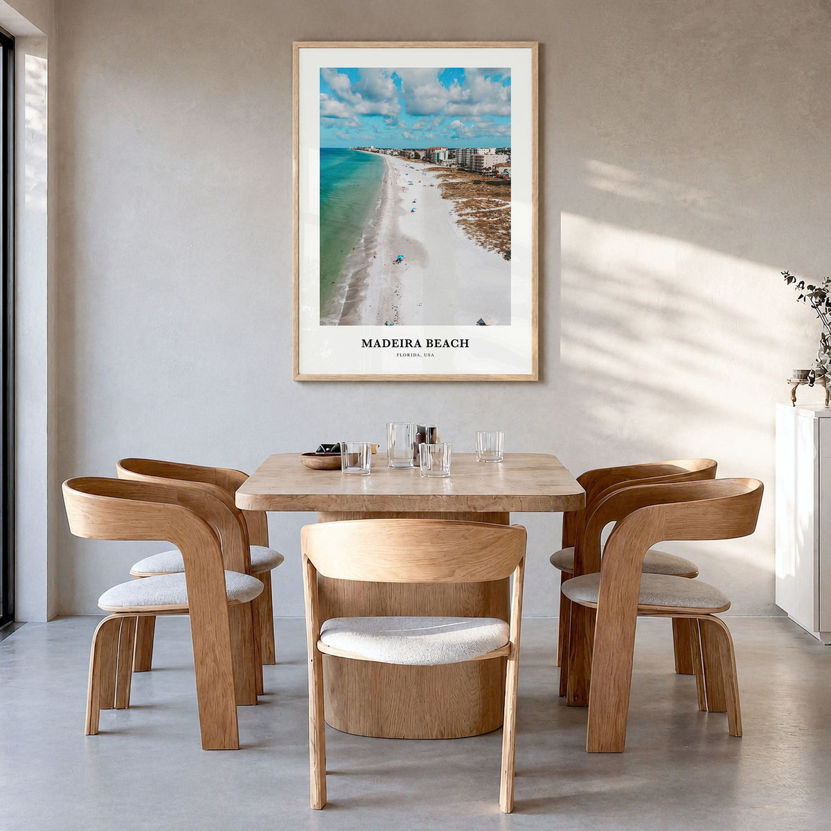 Madeira Beach Classic Poster in a natural wood frame, hanging in a dining room