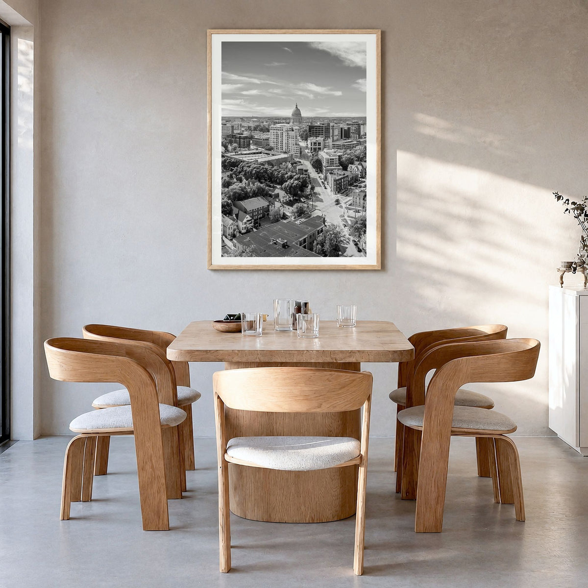 Madison Photo No 1 Poster in a natural wood frame, hanging in a dining room, white border