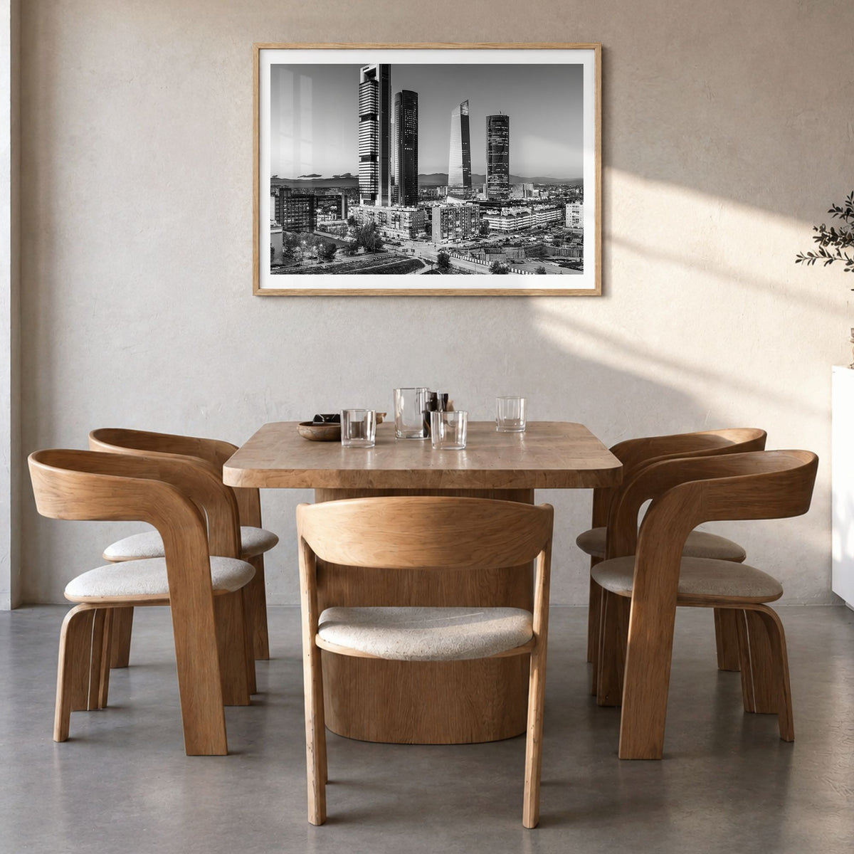 Madrid Photo Poster in a natural wood frame, hanging in a dining room, white border