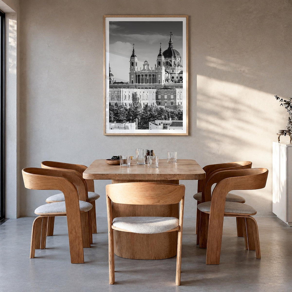 Madrid no. 1 black & white photo poster of Spain – vertical wall art in natural wood frame with white border, hanging on wall