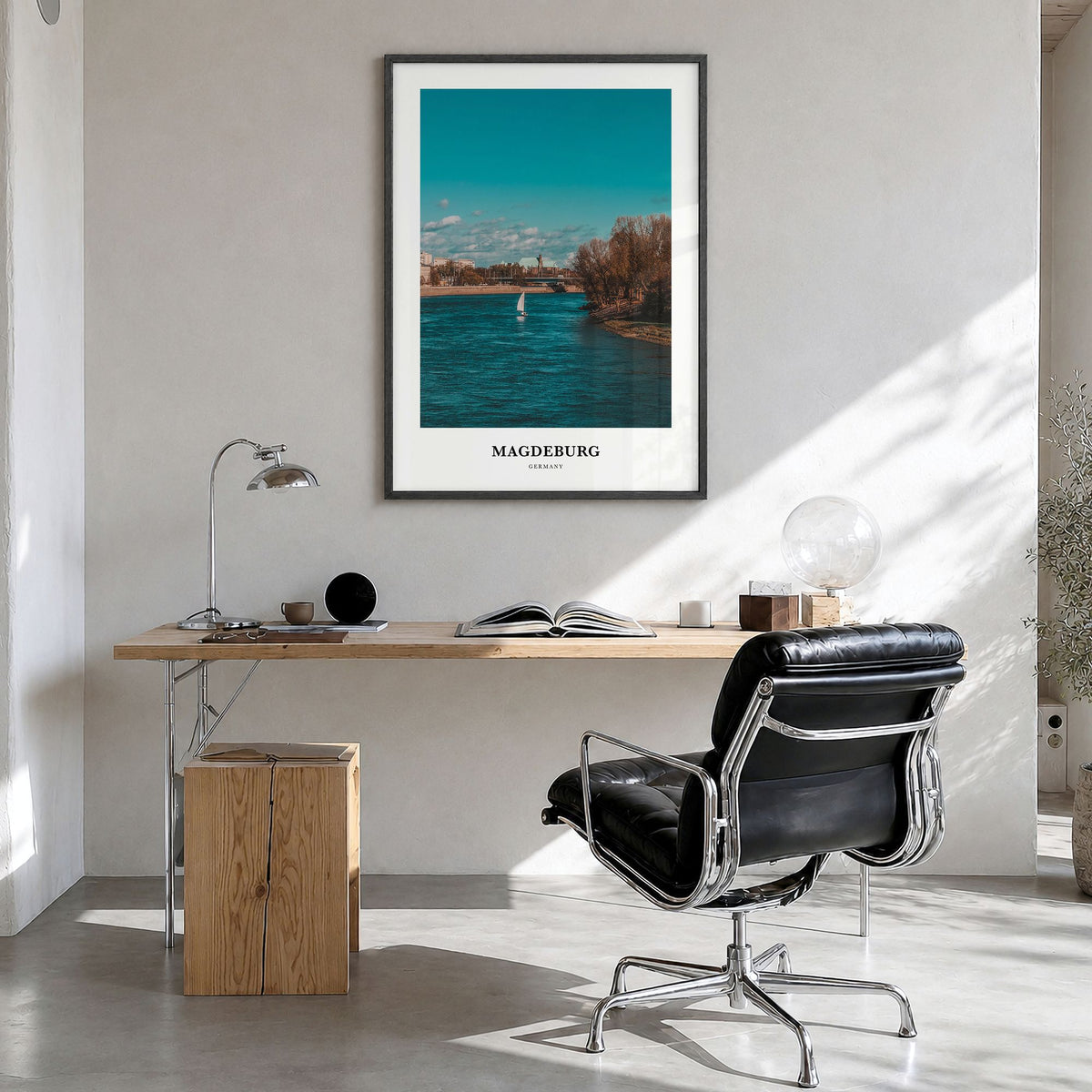 Magdeburg Classic No 1 Poster in a black wood frame, hanging in a bright home office