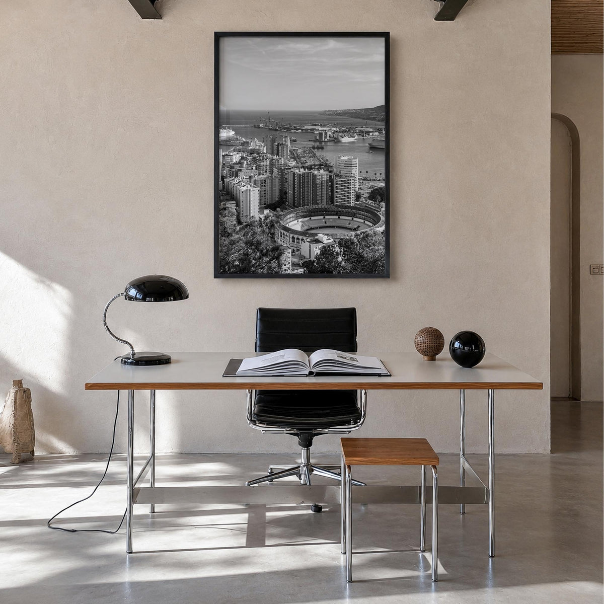 Málaga black & white photo poster of Spain – vertical wall art in black wood frame, hanging on wall