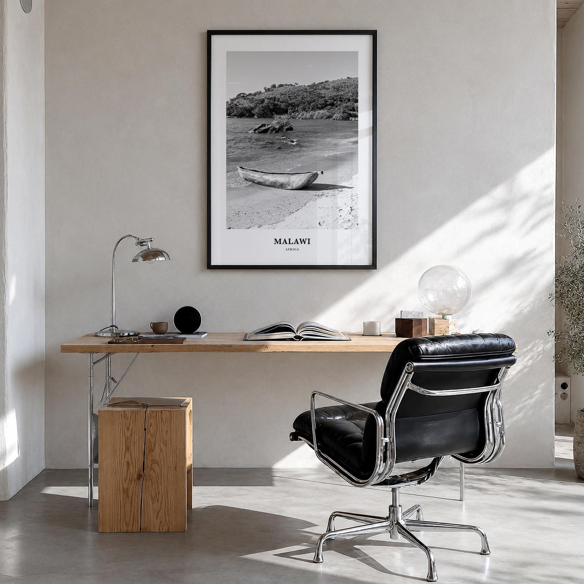 Malawi black & white classic poster of Africa – vertical wall art in black wood frame, hanging on wall