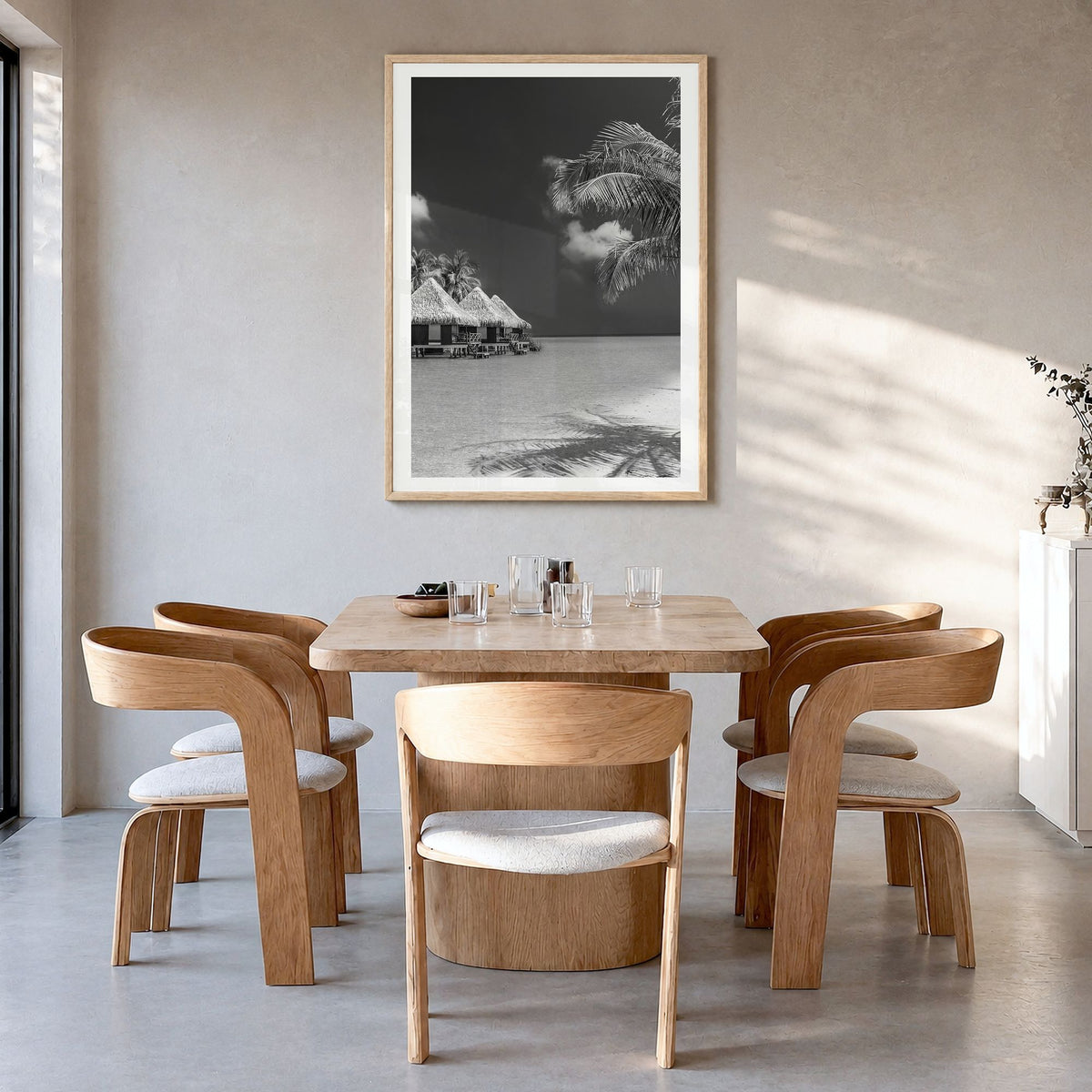 Maldives Photo Poster in a natural wood frame, hanging in a dining room, white border