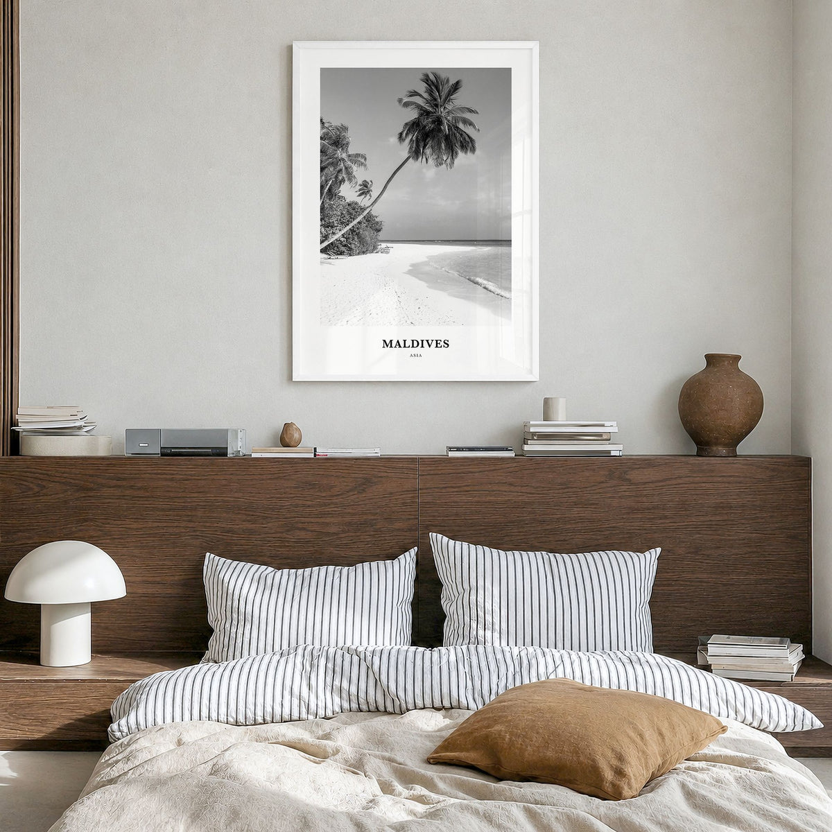 Maldives Classic No 1 Poster in a white wood frame, hanging in a bedroom