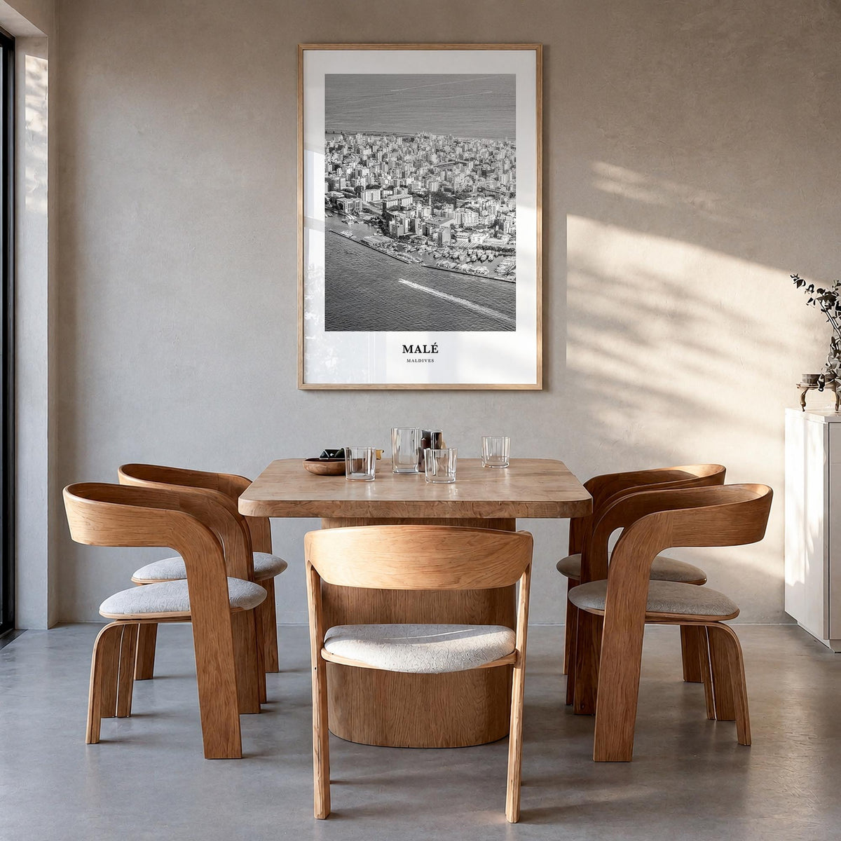 Malé black & white classic poster of Maldives – vertical wall art in natural wood frame, hanging on wall